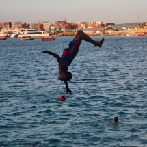 Boy with the port of Zanzibar City in the background